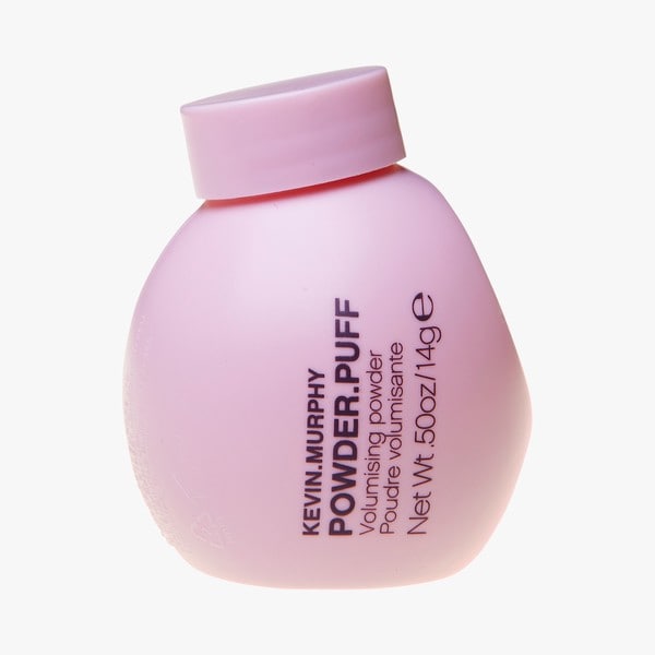 Light pink, rounded bottle of Kevin.Murphy Powder.Puff volumising powder, 14g, featuring bold black text and a screw-top lid.