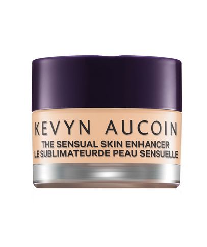 Debenhams Women's the Sensual Skin Enhancer in Sx5, a creamy, beige foundation in a sleek glass jar with a dark purple lid, designed for a natural, radiant finish.