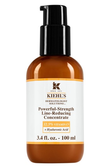 Brown glass bottle with a black pump top, labeled "Kiehl's Powerful-Strength Line-Reducing Concentrate," featuring 12.5% Vitamin C and Hyaluronic Acid, 3.4 fl. oz. size.