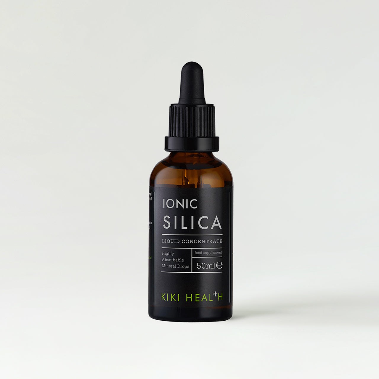 Amber glass bottle with a black dropper lid, labeled "IONIC SILICA" in bold white letters, featuring a green accent and text indicating it's a 50ml liquid concentrate by KIKI Health.