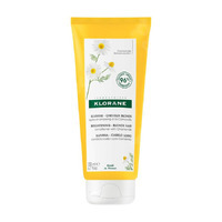 Bright yellow tube of KLORANE Brightening Conditioner with Camomile for Blonde Hair, featuring a floral design and green accents, 200ml size, showcasing its natural ingredients.
