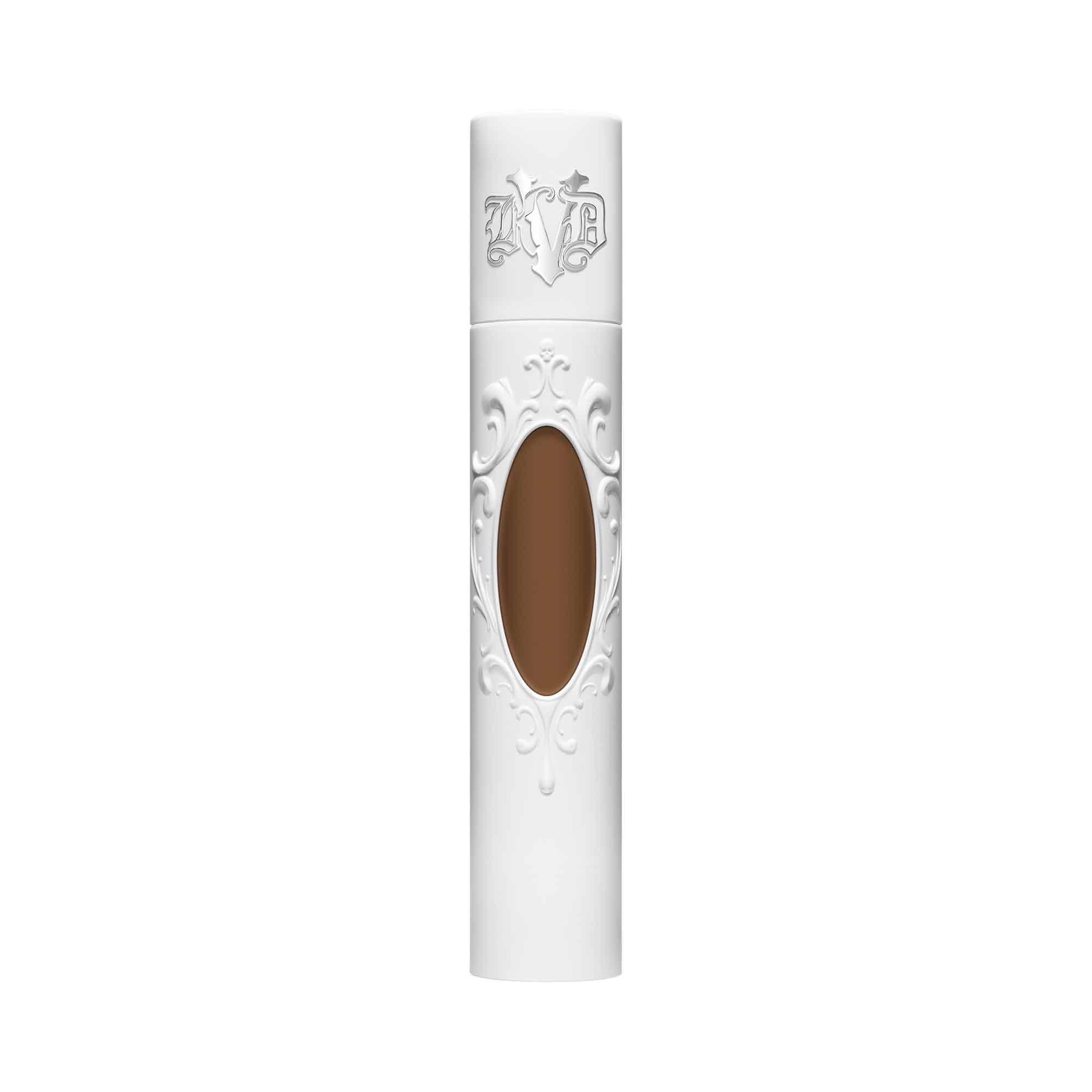 KVD True Portrait 078 Tan Liquid Foundation in a sleek white tube with ornate detailing and a transparent window showcasing the tan shade, 30ml size.