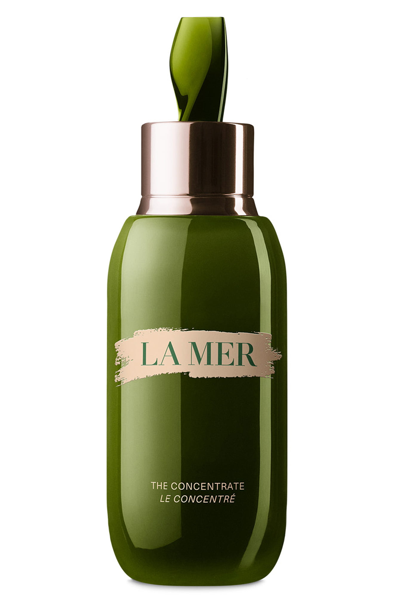 Green glass serum bottle with a sleek design, featuring a gold and pink label that reads "LA MER - THE CONCENTRATE," topped with a dark green applicator.