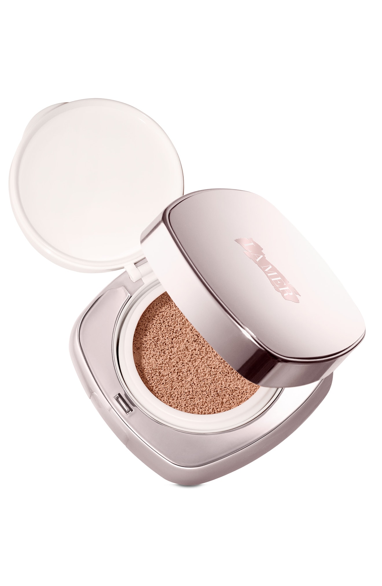 Luminous Lifting Cushion Foundation in Pink Porcelain 01 by La Mer, featuring a sleek silver compact with a white lid and a cushion applicator inside.