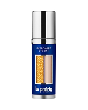 La Prairie Skin Caviar Luxe Eye Lift Serum in a sleek silver and blue bottle, featuring a clear section showcasing golden caviar beads and a creamy serum.