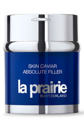 Blue glass jar with a silver lid, labeled "Skin Caviar Absolute Filler" and "La Prairie Switzerland," containing 60ml of volume-enhancing face cream.