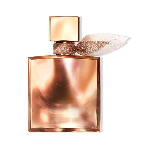 A sleek, rose gold perfume bottle with a square cap, featuring a delicate, glittery ribbon and a smooth, reflective surface.