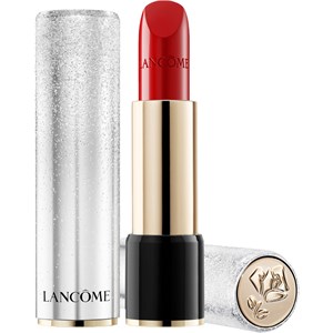 Lancôme L'Absolu Rouge Holiday Edition lipstick in a sleek silver and black tube, featuring a shimmering cap and a bold red sheer lipstick inside.