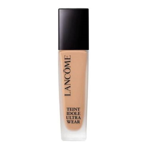Lancôme Teint Idole Ultra Wear 24h Foundation in Nude features a sleek glass bottle with a black cap, showcasing a creamy beige liquid ideal for a natural finish.
