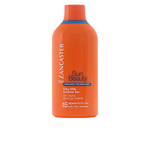 Bright orange bottle of Lancaster Sun Beauty Silky Tanning Milk SPF 15, featuring a blue label with product details and a sleek, curved design.