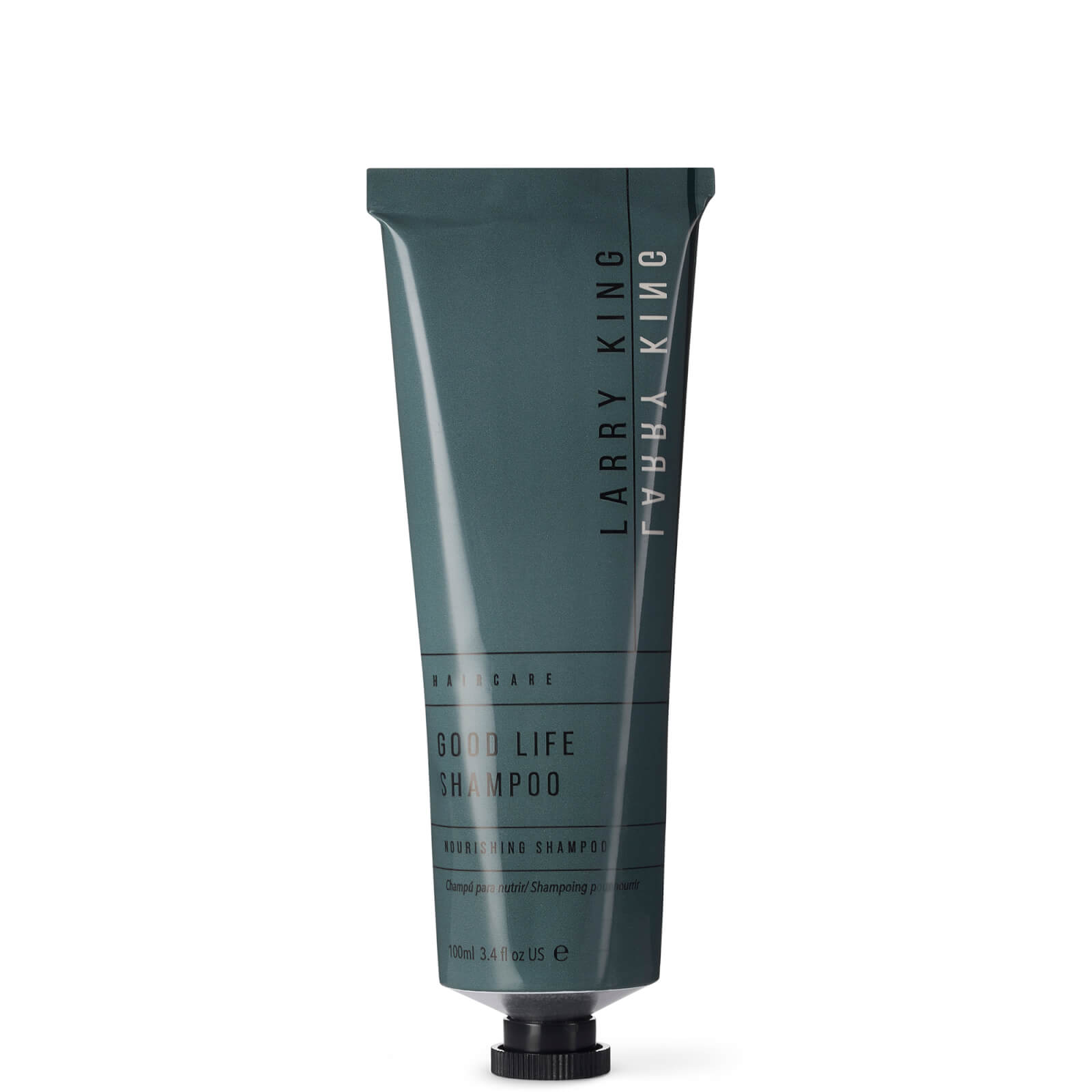 Dark teal tube of "Larry King Haircare City Life Shampoo" with minimalist white text, featuring a flip-top cap and a sleek design, holding 100ml of nourishing shampoo.