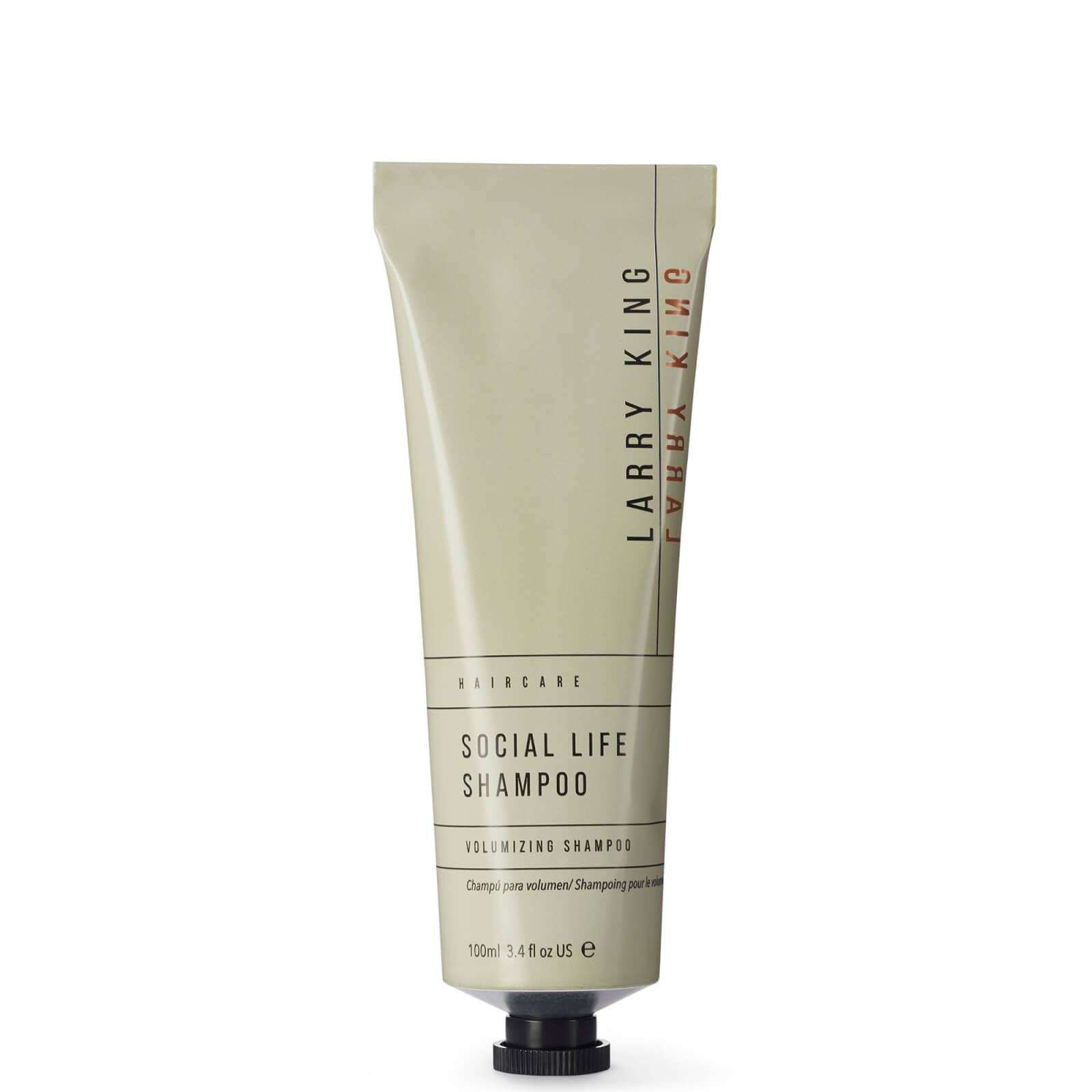 Green 100ml tube of Larry King Haircare Social Life Shampoo, featuring a minimalist design with bold black text and a matte finish, labeled as a volumizing shampoo.