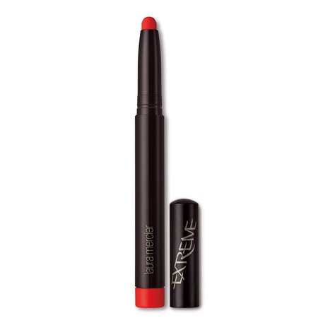 Laura Mercier Velour Extreme Matte Fire Lipstick in a sleek black tube with a vibrant red tip, featuring a twist-up design and the word "EXTREME" in bold lettering.