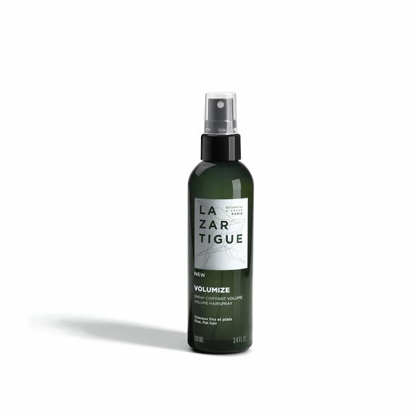 Green spray bottle with a black nozzle, featuring a white label that reads "LAZARTIGUE" and "VOLUMIZE" in bold text, designed for volumizing hair, 100 ml.