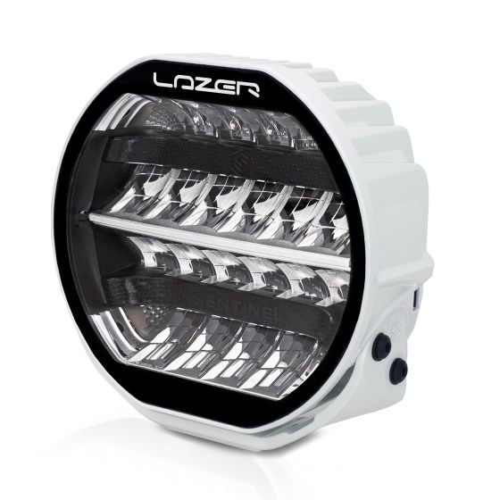Sentinel LED light with a white case and black bezel, featuring a circular design and multiple reflective elements for enhanced brightness.