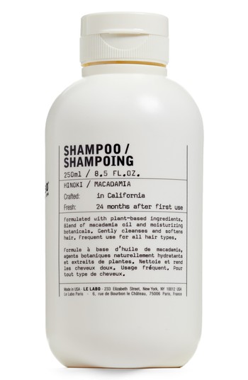 Clear bottle of Le Labo Hinoki Shampoo, 250ml, featuring a minimalist design with black text, crafted in California, and labeled for all hair types.