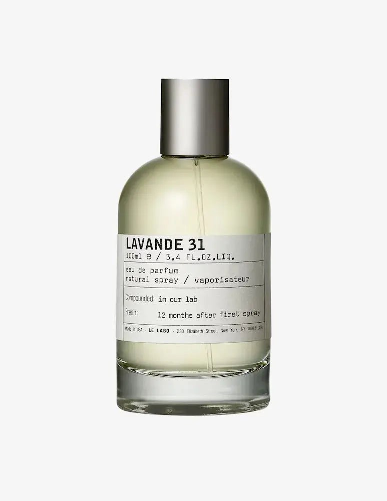Clear glass bottle with a minimalist design, featuring a white label with black text, containing 50 ml of lavender-scented perfume.
