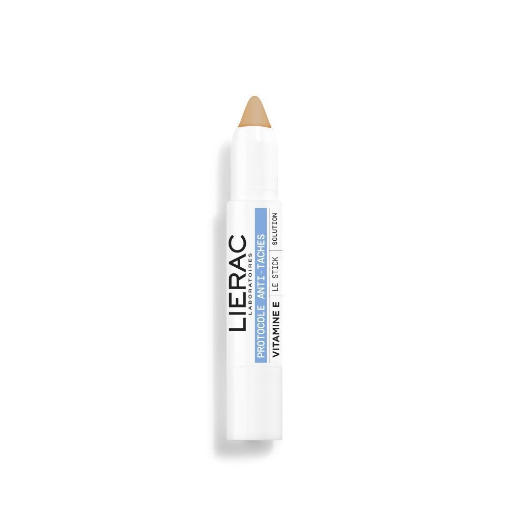 Lierac Protocol Le Stick Tinta Antimacchia SPF 50 is a white, twist-up stick with a beige tip, featuring a sleek design and labeled with the brand name and product details.