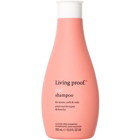 Light pink bottle of Living Proof Curl Shampoo, 340ml, featuring a sleek design and white text, labeled as sulfate-free for waves, curls, and coils.
