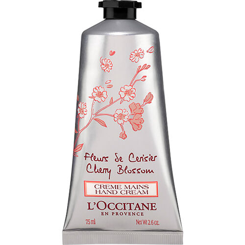 Silver metal tube of L'Occitane Cherry Blossom Hand Cream, featuring pink floral designs and text, with a black twist cap, containing 75ml of cream.