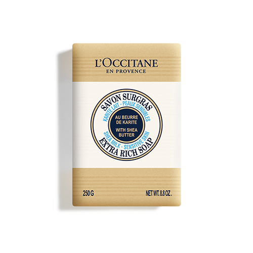 L'Occitane Shea Butter Extra Rich Soap in a beige cardboard box, featuring a circular label with blue text, highlighting its shea milk formula for sensitive skin, 250g size.