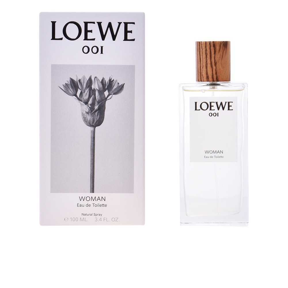 Clear glass bottle with a wooden cap, featuring a minimalist design; accompanied by a floral-themed box labeled "LOEWE 001 WOMAN Eau De Toilette Spray" in elegant typography.
