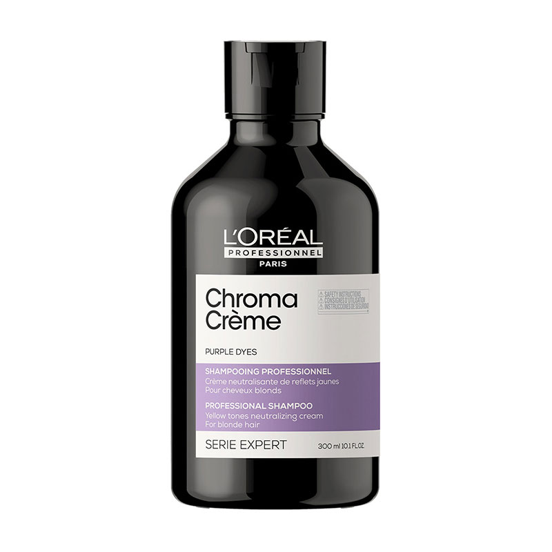 Black bottle of L'Oréal Professionnel Serie Expert Chroma Crème, featuring a white label and purple accents, designed to neutralize yellow tones in blonde hair, 300 ml size.