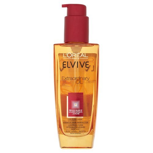 L'Oreal Elvive Extraordinary Oil for coloured hair in a transparent 100ml bottle with a red pump cap, featuring an orange oil color and a label highlighting its nourishing properties.