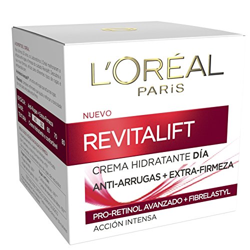 White box with gold and red accents, labeled "L'Oréal RevitaLift" and "Crema Hidratante Día," featuring anti-wrinkle and firming claims, with a 50ml size indication.