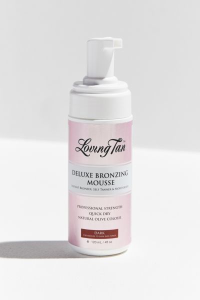 Loving Tan Deluxe Bronzing Mousse in a 120ml pump bottle, featuring a pink and white label, labeled "Dark," with professional strength and quick-dry attributes.