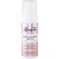 Loving Tan Deluxe Bronzing Mousse in a 120ml bottle features a sleek white and rose gold design, with a pump dispenser for easy application and a label indicating medium shade.