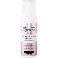 Loving Tan Deluxe Bronzing Mousse in Ultra Dark, 120ml, features a sleek pump bottle with a pink and white design, ideal for achieving a deep, natural tan.