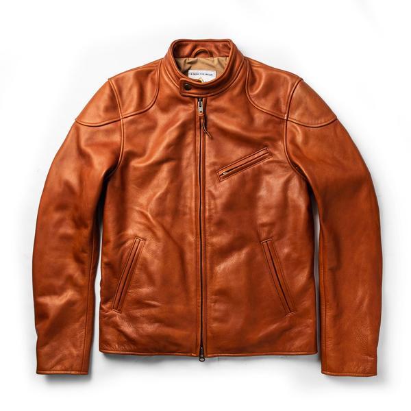 Band collar moto jacket in rich whiskey steerhide leather, featuring a sleek design, zippered chest pocket, and smooth, tailored fit.