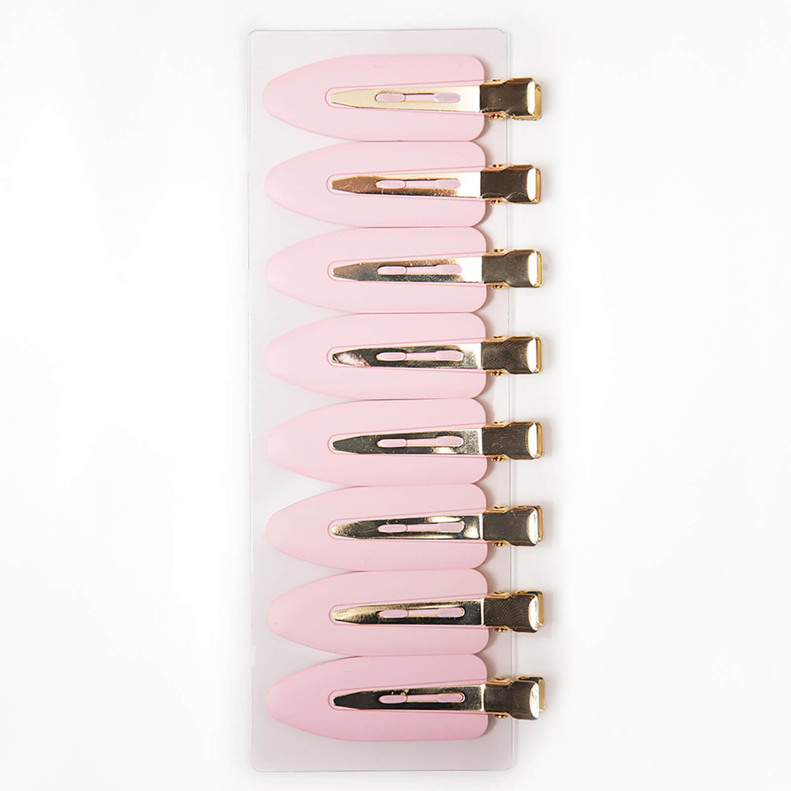 Eight pink setting clips with gold metal accents, arranged on a clear backing, designed for hair styling and securing sections.