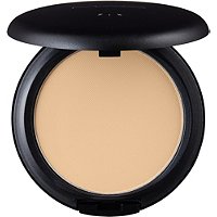 Black compact with a smooth, round lid, containing a light beige powder foundation labeled "C4" for a matte finish and even skin tone.