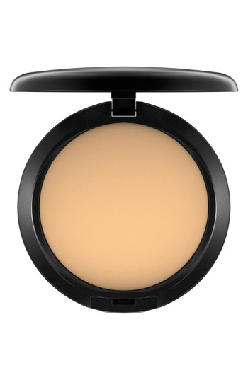 Round compact containing a smooth, light beige powder foundation with a black lid, labeled "Mac Studio Fix Powder Plus Foundation 15g C40."