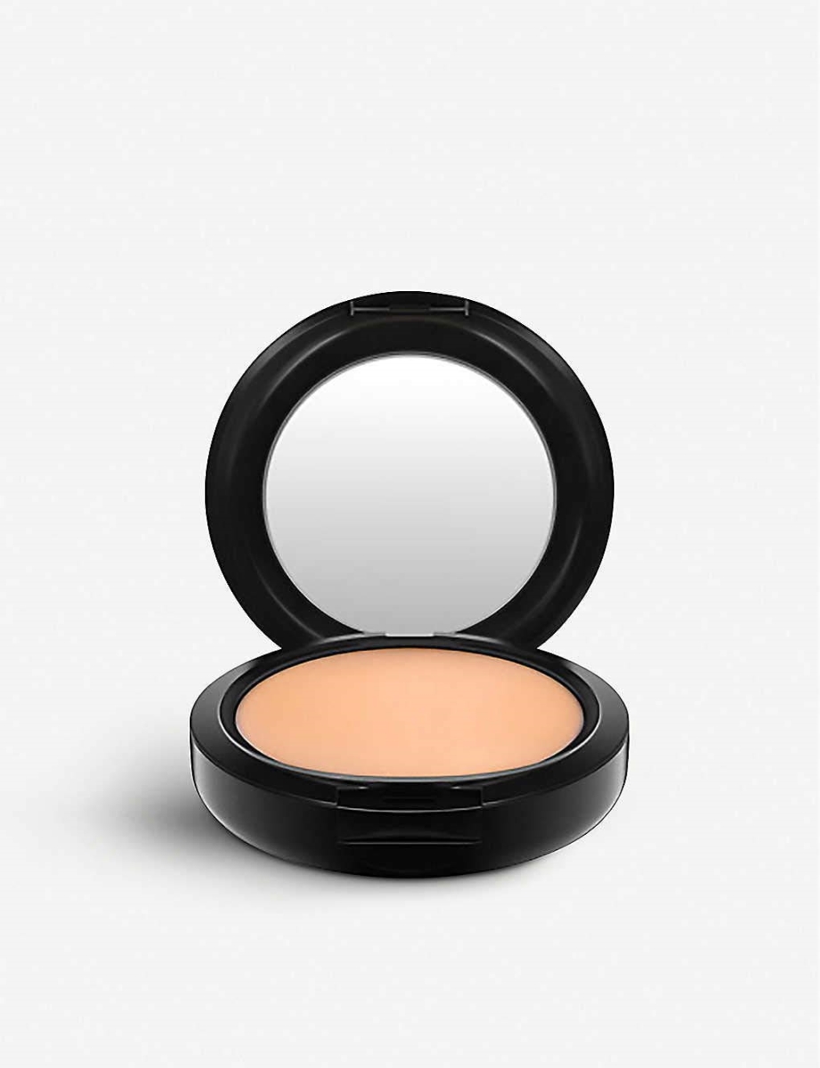 Compact powder foundation in beige with a sleek black casing, featuring a mirror inside the lid and a smooth, creamy texture.