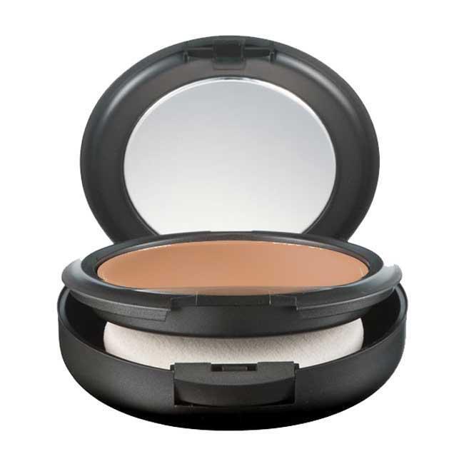Compact powder foundation in beige shade with a smooth surface, housed in a sleek black case featuring a mirror and a white applicator sponge.