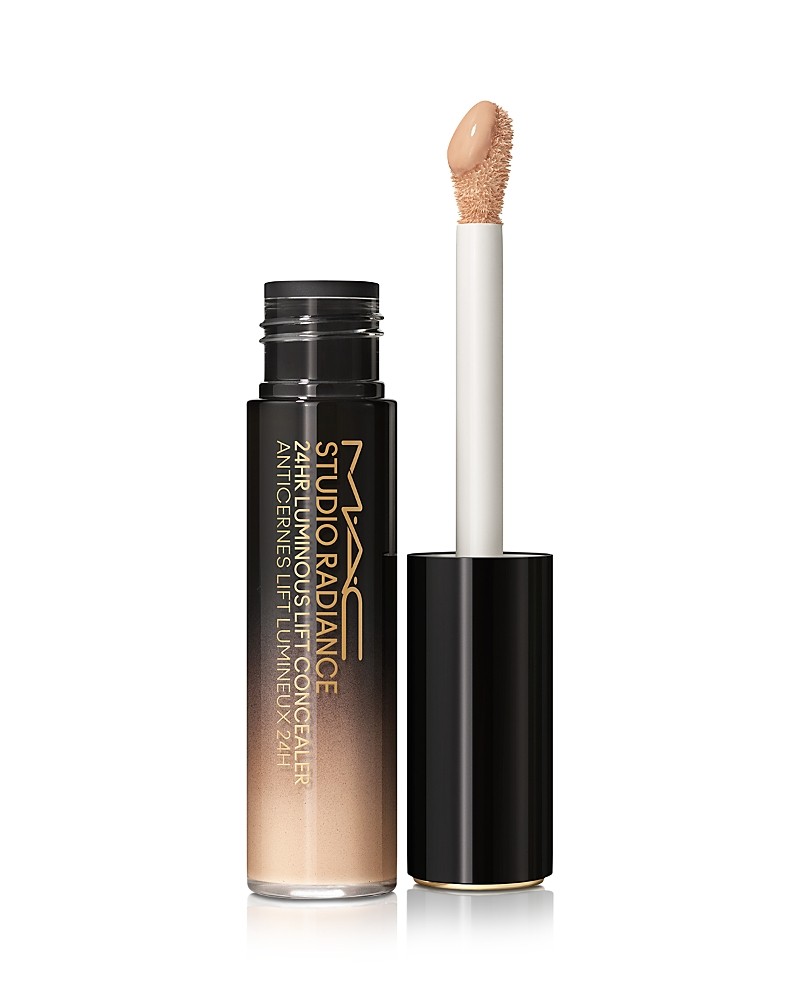 MAC Studio Radiance 24HR Luminous Lift Concealer features a clear tube with a black cap, showcasing a light beige liquid and a doe-foot applicator for precise application.