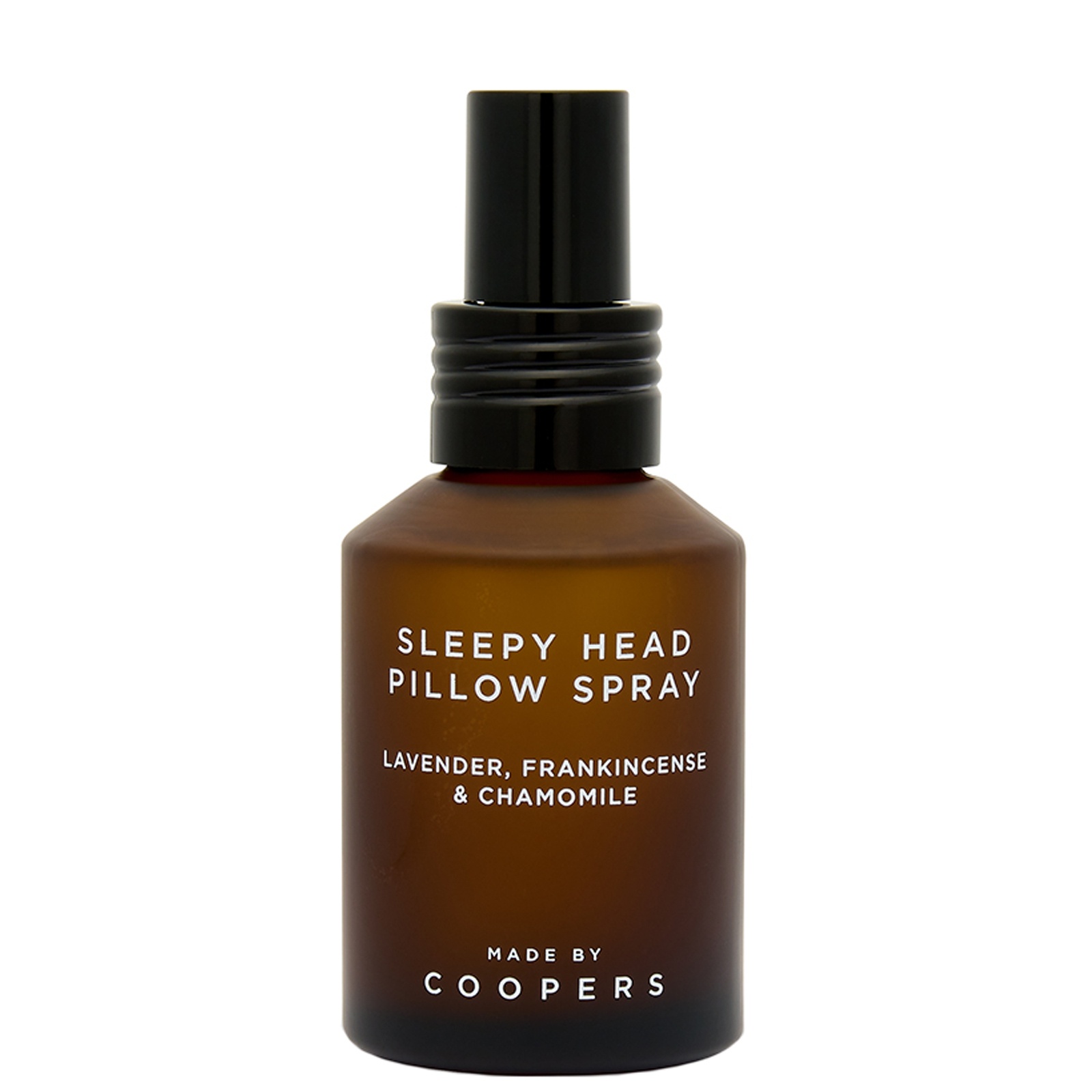 Amber glass bottle with a black spray nozzle, labeled "Sleepy Head Pillow Spray" featuring lavender, frankincense, and chamomile, 60ml, by Made By Coopers.