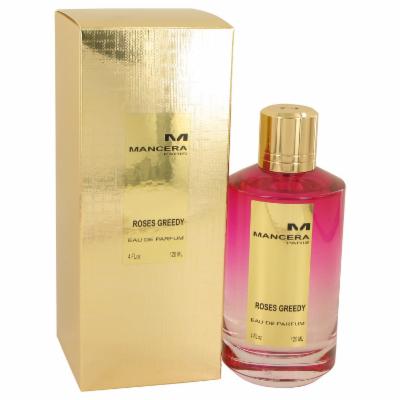A 120ml bottle of Mancera Paris Roses Greedy Eau De Parfum, featuring a pink liquid, a gold cap, and a sleek glass design, alongside a shiny gold box with the brand logo.