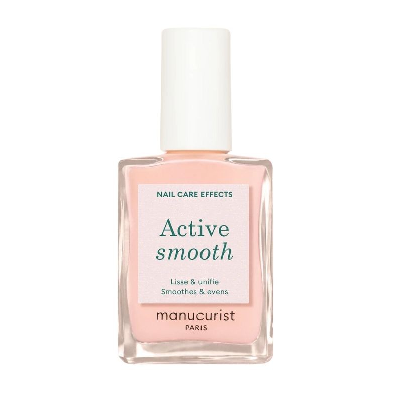 Clear glass bottle with a square shape, featuring a soft pink liquid inside, a white cap, and a label that reads "Active smooth" in teal text, by Manucurist Paris.