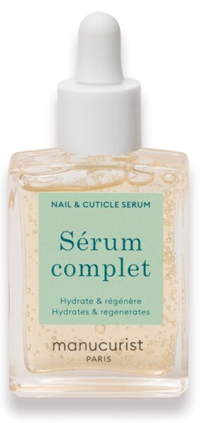 Clear glass bottle with a white dropper cap, featuring a light green label that reads "Sérum complet" in blue, designed for nail and cuticle hydration and regeneration.