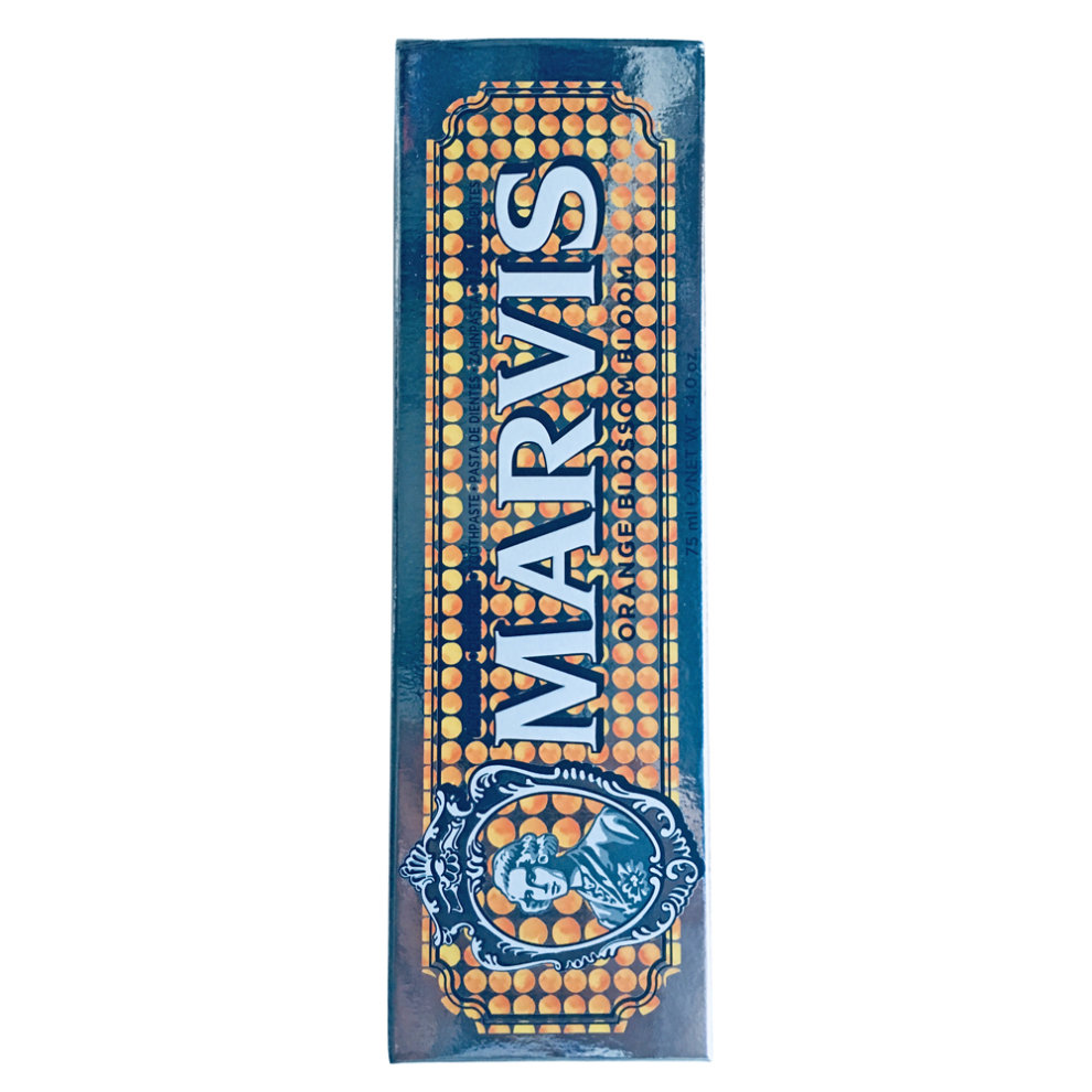 Marvis Orange Blossom Bloom Toothpaste 75ml features a vibrant blue and orange box adorned with a vintage logo and decorative dots, showcasing its floral scent.