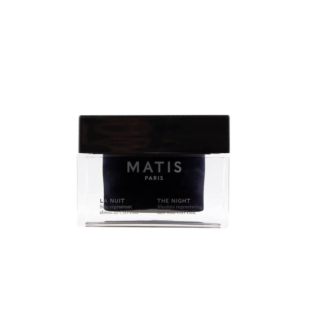 Black and clear glass jar with a sleek black lid, labeled "Matis Paris LA NUIT Crème Visage 50ml" in white text, showcasing a luxurious night cream design.