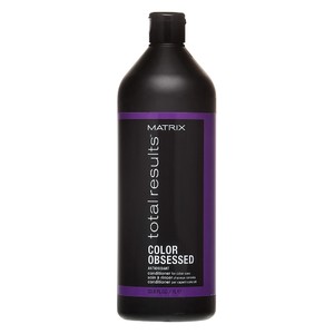 Matrix Color Obsessed Color Care Balm in a 1000 ml black bottle with a purple label, designed to protect and maintain color-treated hair.
