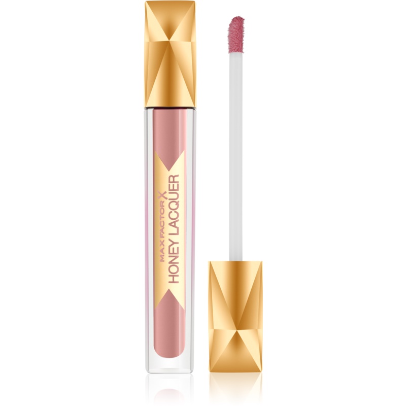 Max Factor Colour Elixir Honey Lacquer in shade 05 Honey Nude features a sleek transparent tube with a gold cap and a soft applicator wand, showcasing a creamy pink gloss.