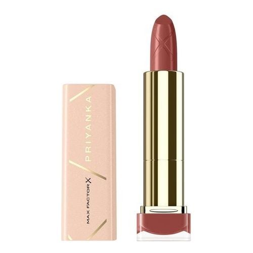Max Factor Colour Elixir Priyanka Lipstick in shade 128 Blooming Orchid, featuring a sleek gold and pink tube with a rich brown hue.