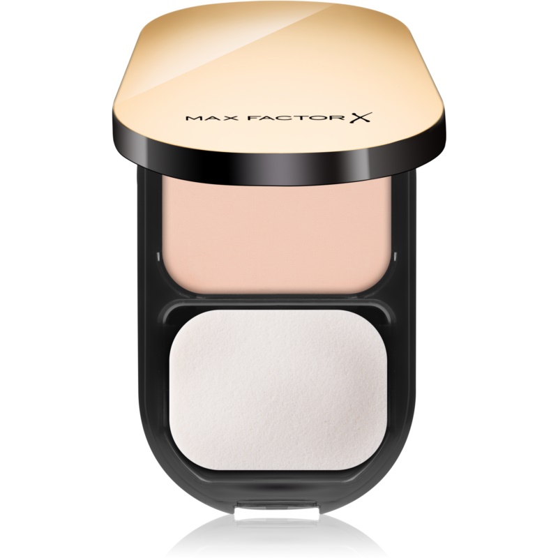 Max Factor Facefinity Compact Foundation in shade 02 Ivory, featuring a sleek gold and black compact with a smooth powder surface and a separate applicator sponge.