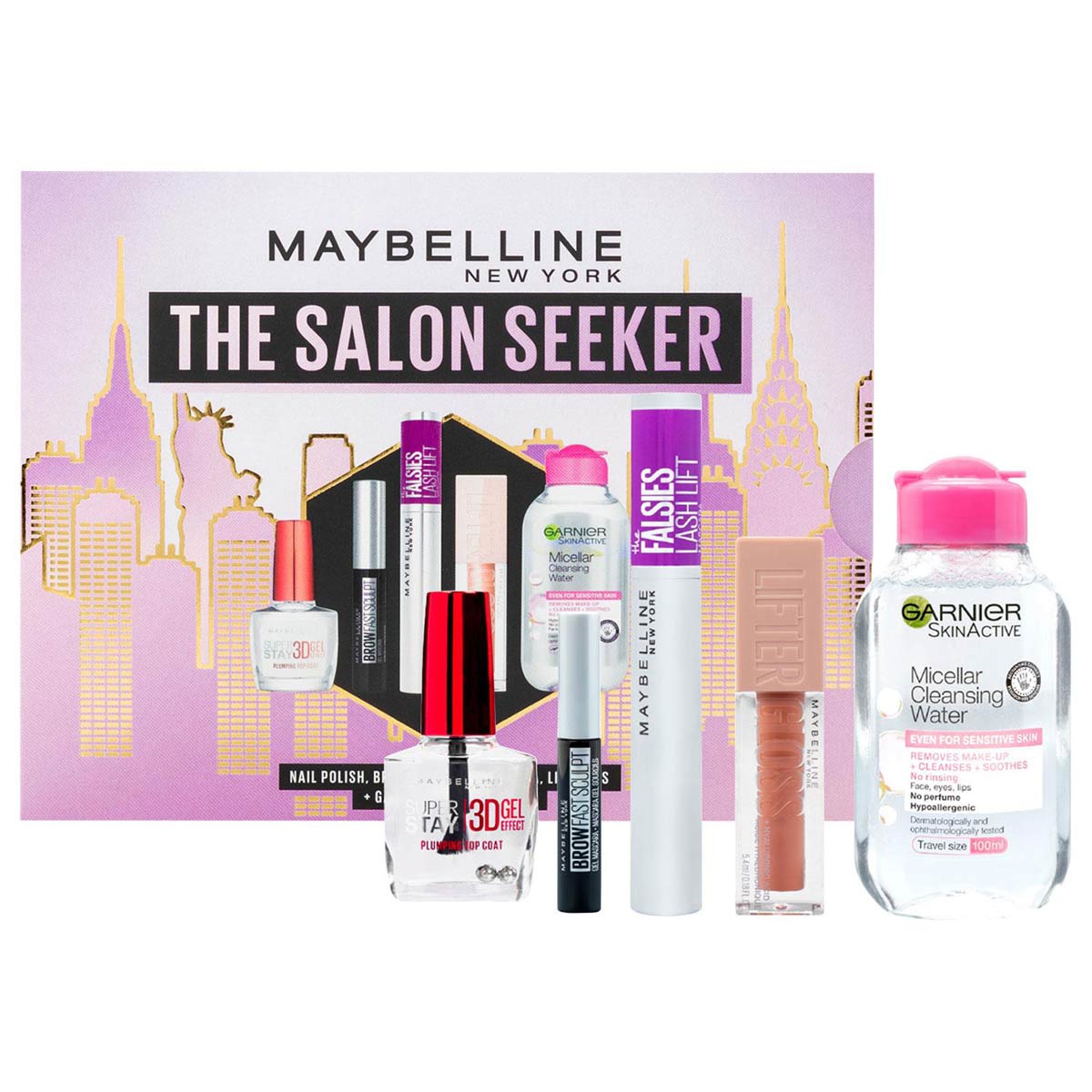 Maybelline Makeup Gift Set featuring a pink box with city skyline, includes nail polish, mascara, lip color, and micellar cleansing water, ideal for holiday gifting.